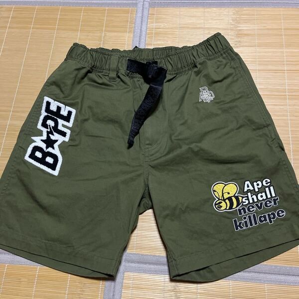 A BATHING APE BAPE KAWS ショーツ ハーフパンツ LOGO NEVER SHALL M オリーブ OLIVE