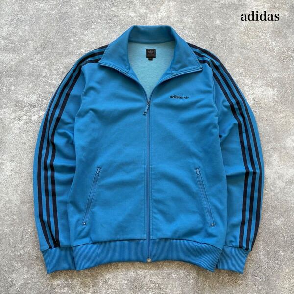 【adidas】ADIDAS アディダス トラックジャケット ジャージ トラックトップ 刺繍ロゴ 万国タグ スリーストライプ 3本ライン 水色 (M)