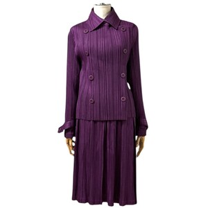 PLEATS PLEASE