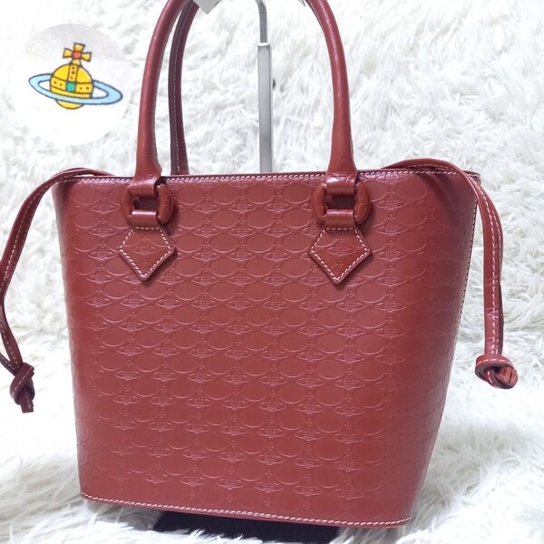 【良品】 Vivienne westwood ヴィヴィアンウエストウッド オーブ 総柄 型押し エンボス 巾着 レザー ハンドバッグ トートバッグ 赤 レッド