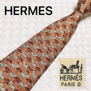 ■美品■HERMES エルメス ネクタイ サバンナのシマウマ アニマル柄 総柄 シルク100% フランス製 7110 OA ブラウン系レンガ ビジネス