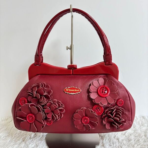 【美品】 Think Bee! ハンドバッグ 口金バッグ 花 フロントロゴ 本革 がま口
