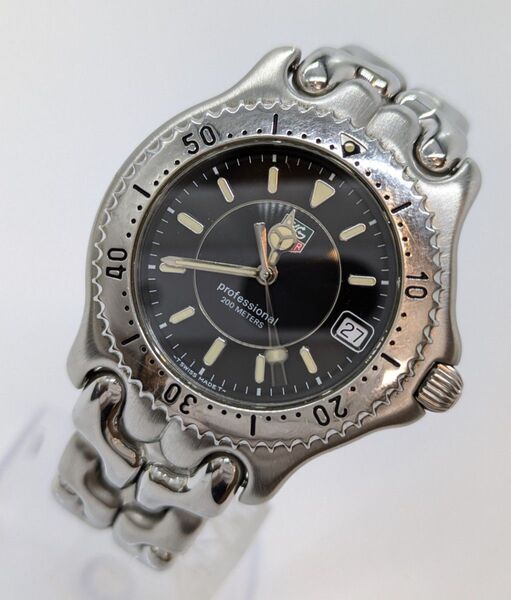 【動作品】TAG HEUER タグホイヤー QZ メンズ腕時計 プロフェッショナル WG1118 黒文字盤 デイト シルバーカラー