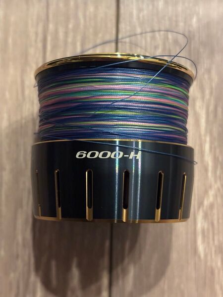 ●●23ソルティガ6000-H 新品エックスブレイド2号300m付き 純正スプールバンド付き