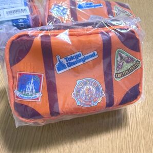 ディズニーバケーションパッケージ ポーチミニタオル2枚セット東京ディズニーリゾート 小物入れ オレンジ 未使用