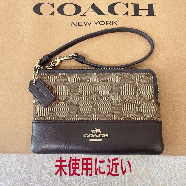 期間限定価格!未使用に近い★COACH コーチ ポーチ 財布 小物入れ シグネチャー ブラウン系 キャンバス×レザー チャーム付き
