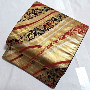 A着物くつろぎ 流れに桜模様 金糸 黒 赤 キラキラ 六通 正絹 振袖・礼装用 フォーマルな袋帯 送料無料 仕立て上がり リサイクル