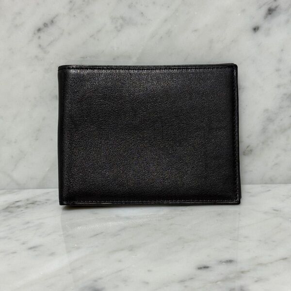 TUMI トゥミ 二つ折り財布 ブラック 黒 本革 レザー 無地 札入れ