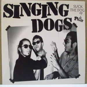 SINGING DOGS-Suck The Dog (German 154 Ltd.Clear Green Vinyl