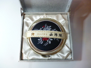 Φ west . woven compact mirror Θ hand-mirror 