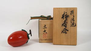 . empty . lacquer persimmon incense case also box also cloth tea utensils 
