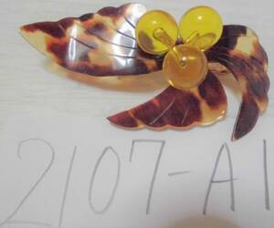 book@ tortoise shell lakto sphere using. feather. like brooch 