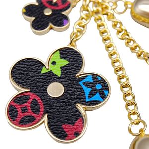 フラワー キーホルダー バッグチャーム ブラック タッセル キーチェーン 可愛い 飾り お花チャーム QM027
