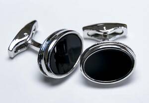 * a bit stylishly cuffs button . round shape black silver is tuxedo .