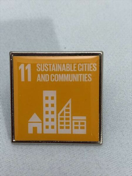 SDGsピンバッジ　1個「(1540円税込・送料無料）11. 住み続けられるまちづくり（Sustainable cities and communities）国連ショップ購入UN61