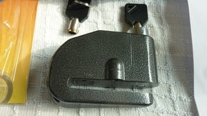  disk lock alarm / bike theft prevention easy convenient certainty lock small size . one touch 