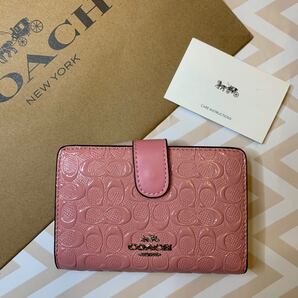 COACH コーチ アウトレット ピンクエナメル 二つ折り財布 新品