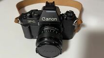 ★美品 レンズ付属★Canon キヤノン NEW F-1 ブラック 一眼レフフィルムカメラ FD 50mm F1.4★_画像1