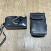 動作品 コニカ KONICA K-mini ミニ コンパクトフィルム カメラ 35mm レンズ フラッシュ 日付 ケース 付き 軽量 小型 シンプル 持運び_画像1