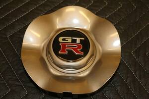 ＢＮＲ３４　スカイラインＧＴ－Ｒ純正ホイールカバー(センターキャップ）新品未使用(１個）ＧＴＲ　V-SPEC２ ミッドナイトパープル N34-84