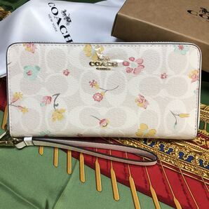 COACH 長財布 ラウンドファスナー シグネチャー 小花柄 ホワイト