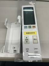 【RL-4-27】Panasonic エアコンリモコン　品番不明　新品/未使用　ホルダー付き_画像1