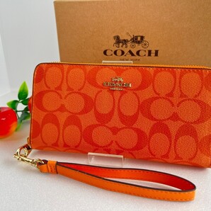 【新品未使用】コーチCOACH長財布 シグネチャー C4452 ラウンドファスナー ストラップ付き オレンジ