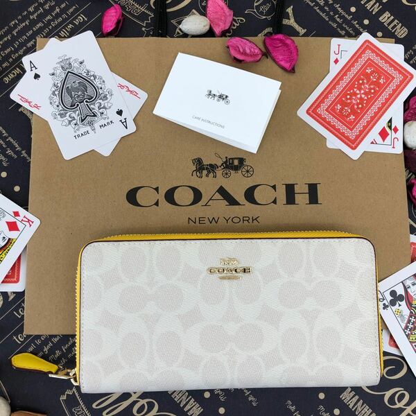 COACH コーチ イエロー×ホワイト シグネチャー 長財布