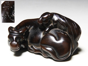 [ luck ].. thing : tree carving netsuke parent . cow regular .