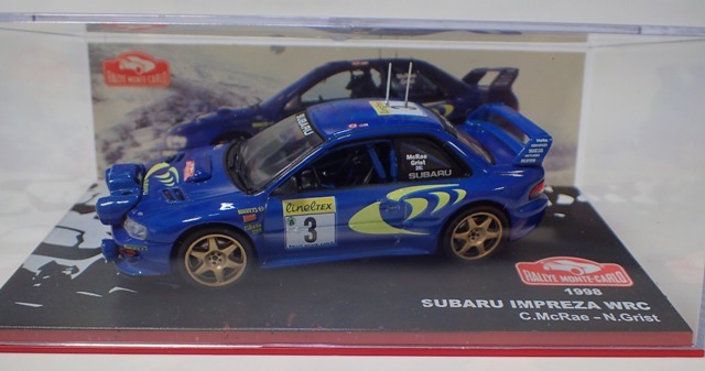 スバル　インプレッサWRC 1997winner 記念ピンバッジ+写真集 三輪車/乗り物 【値下げ】