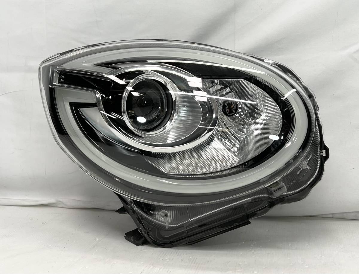 豪華 M700A パッソモーダ 前期 100-69028 左ヘッドランプ LED 純正