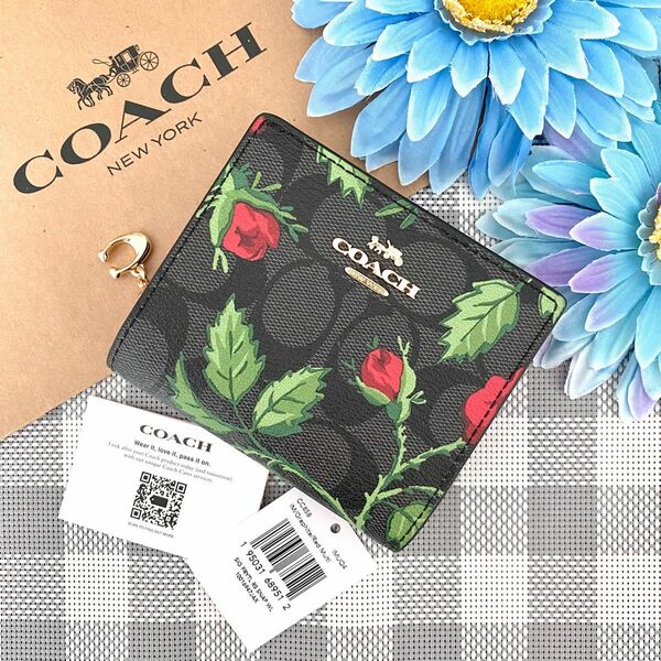 【新品】COACH(コーチ) ブラック 花柄 シグネチャー レザー 折り財布