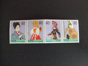 日本切手ー未使用 1988年世界人形劇フェスティバル　60円4枚連刷1組　折れ跡あり