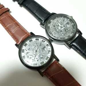  new goods skeleton wristwatch black tea color. two pcs set 10
