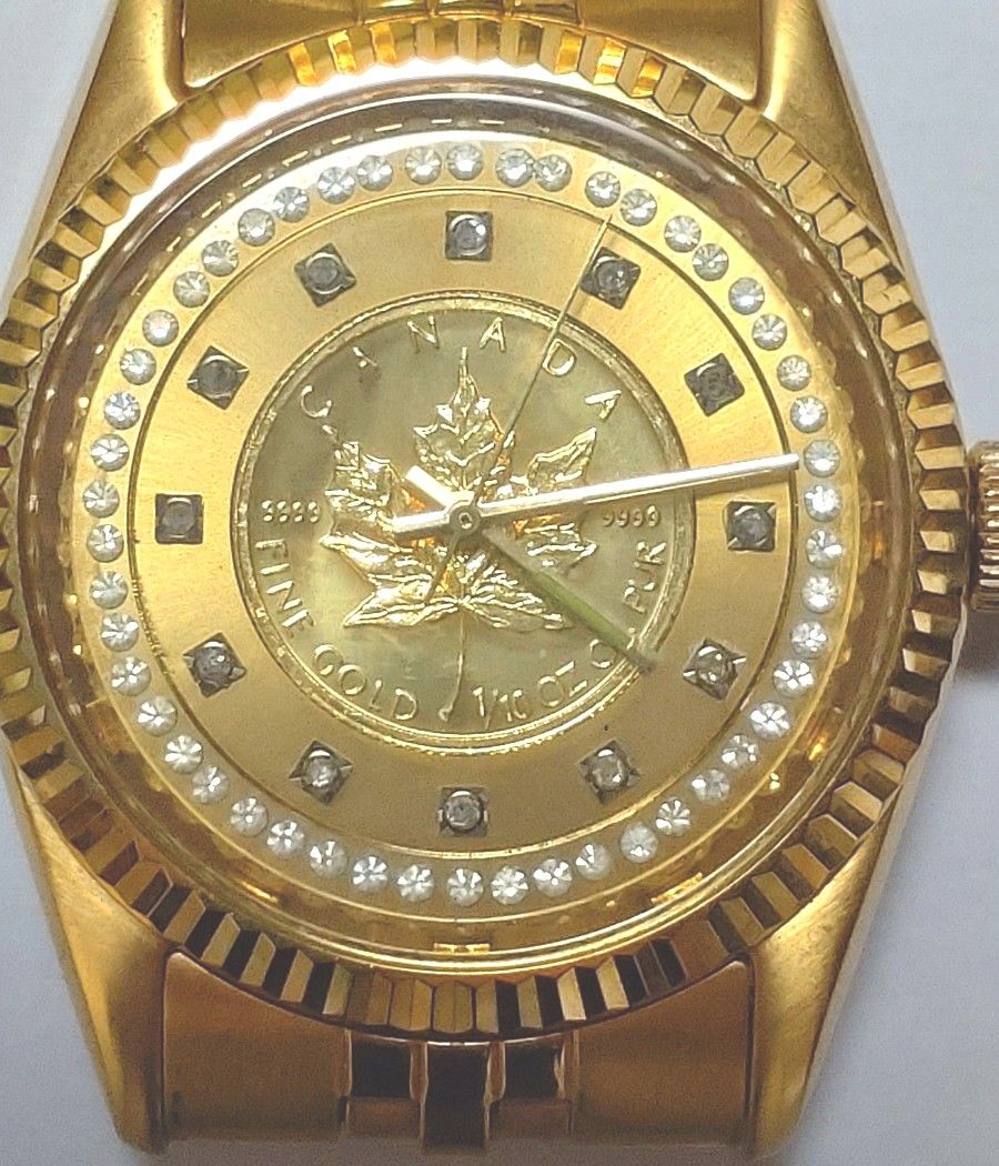 稼動品】 メイプルリーフ金貨 1/10オンス ロダニア 時計 コイン
