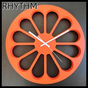 【RHYTHM】スタイリッシュな壁掛け時計 オレンジ　北欧調 木製 高級感 柑橘 太陽 稼働音なし リズム 掛時計 シンプル アナログ 橙