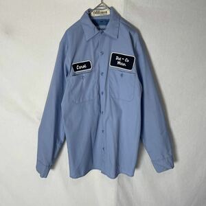 CINTAS 長袖ワークシャツ 古着　Sサイズ　ライトブルー　ヴィンテージ WORK WEAR 企業ロゴ