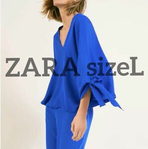 新品タグ付きZARAsizeL タイリボン付きボリューム袖トップス sizeXLXXL相当