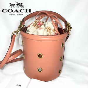 【新品】coach コーチ 2WAY ショルダーバッグ バケット グロメッツ ライトピーチ 69654