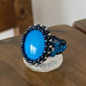 14-16 number beads ring blue green. ellipse beads. fre-ming ring 