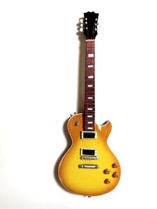 Slashモデルミニチュアギター黄25 cm。ミニ楽器