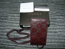 GUCCI グッチ　ストラップ付小物入れ　ケース　IQOS　iPod mini　ZIPPO　GG型押し 新品同様　箱付き　本革_画像1