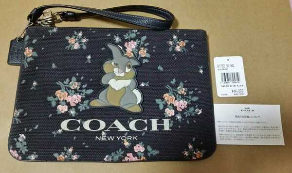 新品 COACH×DISNEY ディズニー とんすけ(タンパー) 花柄　ストラップ付ポーチ コーチ クラッチ バッグ ミッドナイト 紺 送料無料