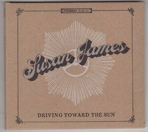 SUSAN JAMES DRIVING TOWARD THR SUN