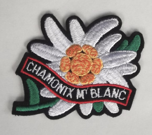  old embroidery badge flower chamonix Montblanc CHAMONIX MT BLANC Alps France Switzerland mountain climbing mountains Alpine plants Europe tourist attraction . earth production 