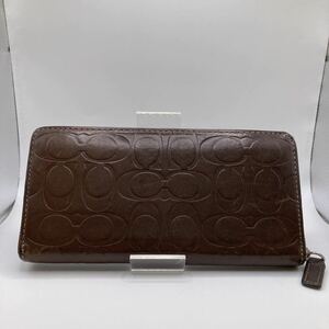 □5354　COACH コーチ 型押し シグネチャー 長財布 札入れ 小銭入れ ラウンドファスナー レザー 革 ダーク ブラウン