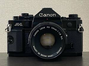 【動作未確認 ジャンク扱い】Canon A-1 キャノン フィルムカメラ ブラックボディ / CANON LENS FD 50mm 1:1.8 S.C. レンズ