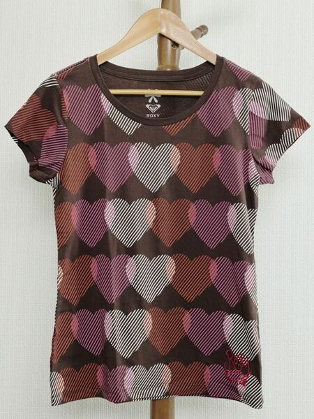 ＜未使用＞＜新品＞＜ハワイで購入＞ROXY ハート総柄プリントゆったりTシャツ　左前裾ロゴ刺繍入り　＜Lサイズ＞　ブラウン系