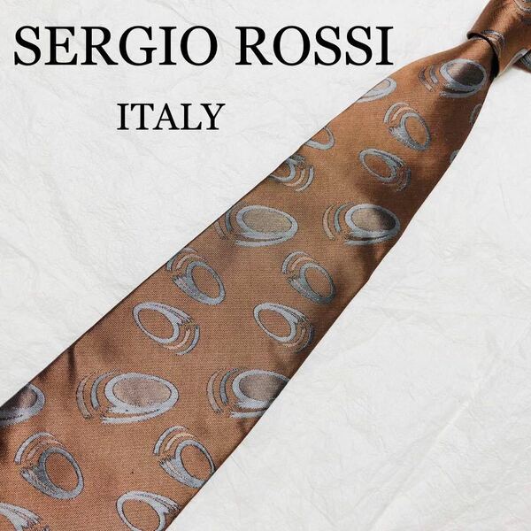 ■美品■SERGIO ROSSI セルジオロッシ　ネクタイ　輪っか　総柄　シルク100% ブラウン系