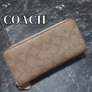 コーチ　COACH　ラウンドファスナー長財布　シグネチャー　PVC　ベージュ